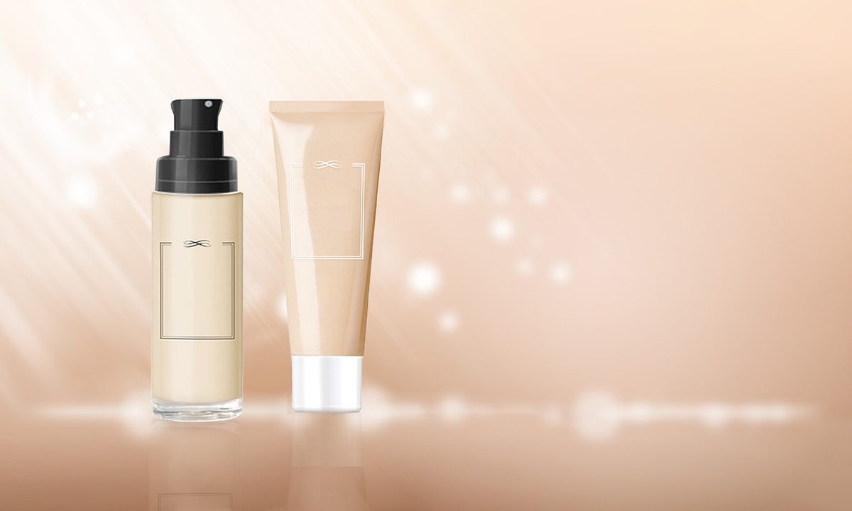 A person applying a vitamin C serum to their face