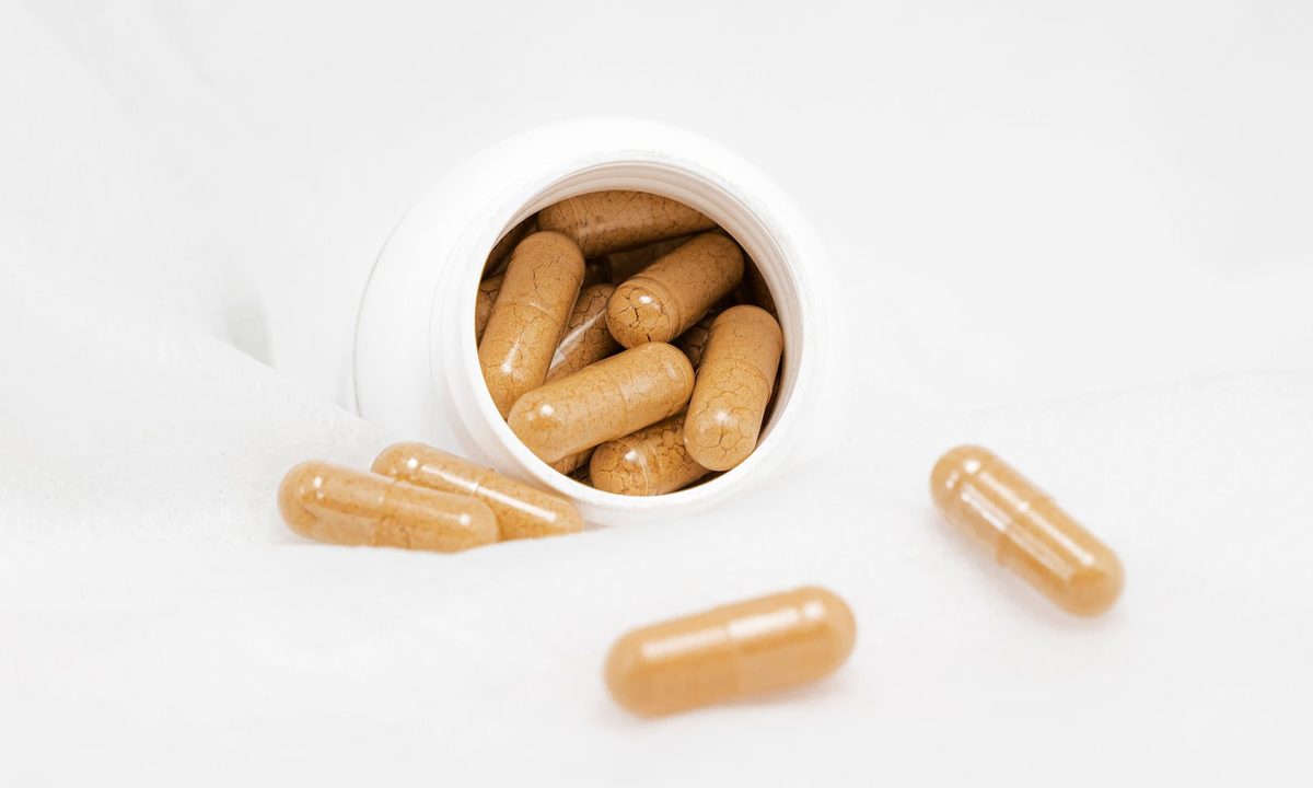 Vitamin supplement bottles with capsules